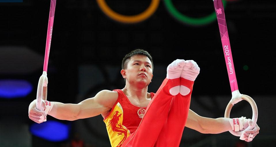 2012年7月30日伦敦北格林威治体育馆内，男子团体体操决赛中的陈一冰
